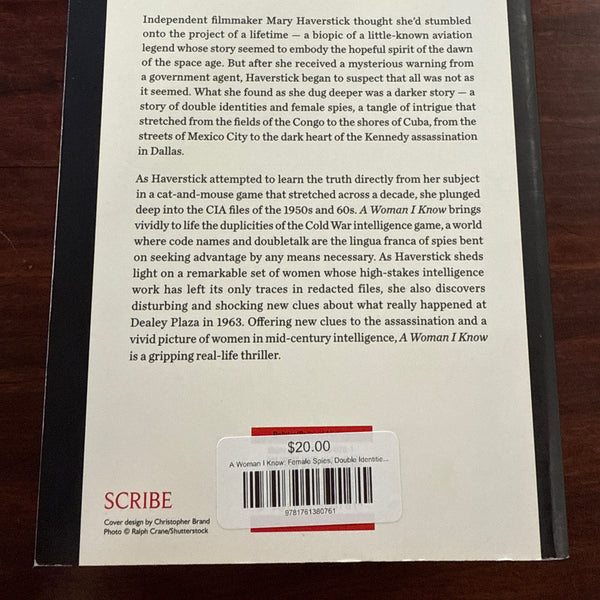 Back cover of 'A Woman I Know' by Mary Haverstick on a wooden surface