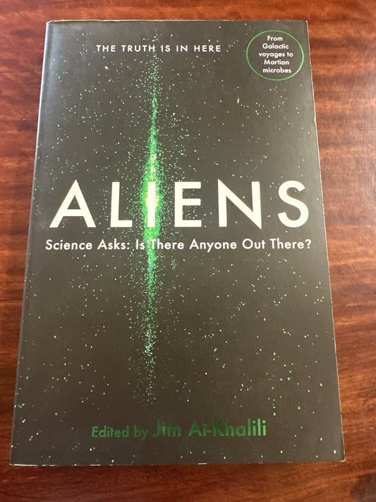 Aliens: Science Asks book cover on wooden surface