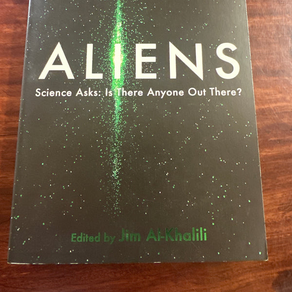 Aliens: Science Asks book cover on wooden surface