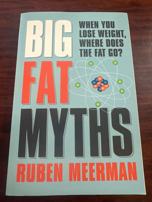 Book titled 'Big Fat Myths' by Ruben Meerman on a wooden surface