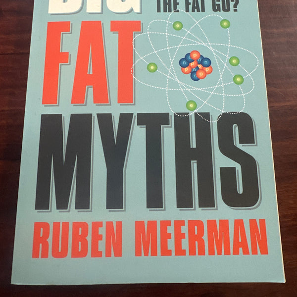 Book titled 'Big Fat Myths' by Ruben Meerman on a wooden surface