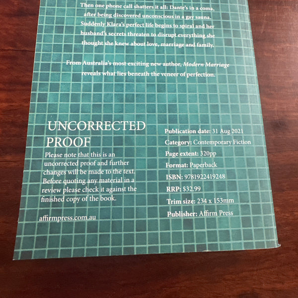 Back Book cover of 'Modern Marriage' by Filip Vukasin with a white dress on a wooden surface.