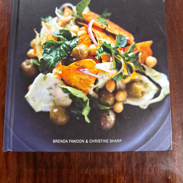 Book titled 'Eat Local' with a cover featuring food on a wooden surface