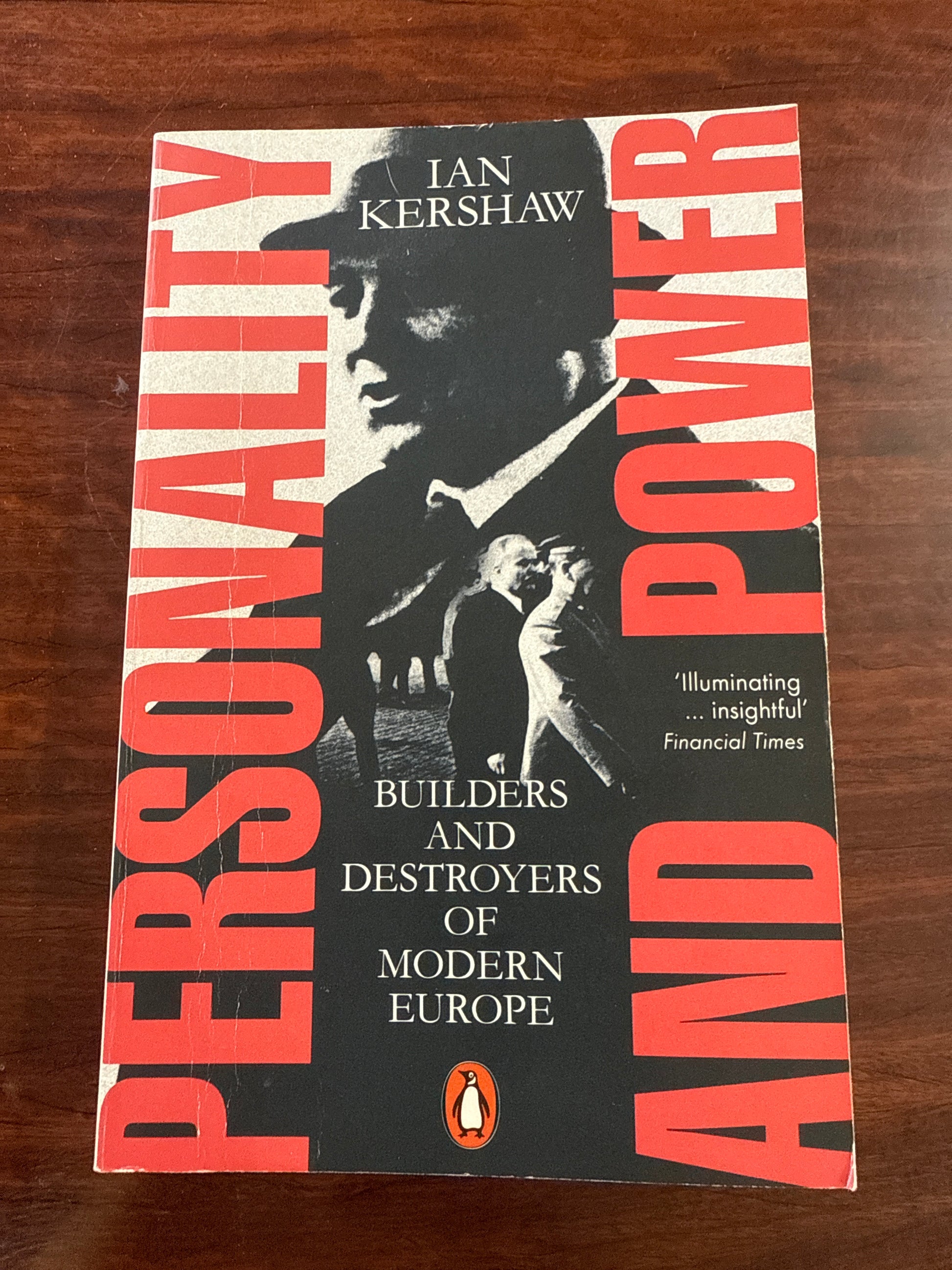 Book cover of 'Power and Personality' by Ian Kershaw on a wooden surface