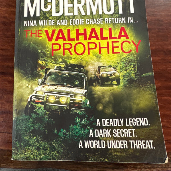 Book titled 'The Valhalla Prophecy' by Andy McDermott on a wooden surface