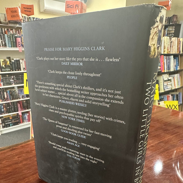 Two Little Girls in Blue Mary Higgins Clark back cover image