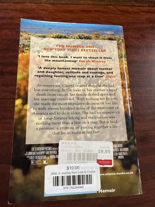 Back cover of Book titled 'Wild' by Cheryl Strayed on a wooden surface